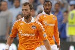 KANSAS CITY, KS - NOVEMBER 06:  Brad Davis #11 of the Houston Dynamo looks up the field against Sporting Kansas City in the first half during the MLS Eastern Conference Championship match at Livestrong Sporting Park on November 6, 2011 in Kansas City, Kansas.  (Photo by Kyle Rivas/Getty Images)