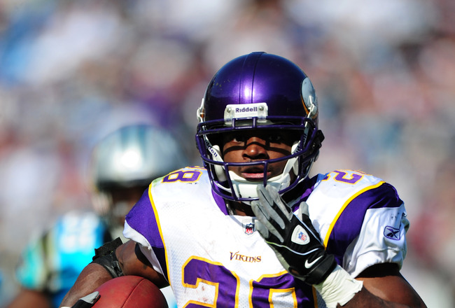 Vikings star running back ADRIAN PETERSON leaves game after rolling left ankle ...