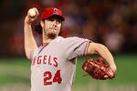 ARLINGTON, TX - AUGUST 26: Dan Haren #24 of the Los Angeles Angels of Anaheim delivers a pitch to the Texas Rangers at Rangers Ballpark in Arlington on August 26, 2011 in Arlington, Texas. (Photo by Rick Yeatts/Getty Images)