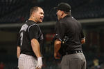 HOUSTON, TX - SEPTEMBER 24: Ty Wigginton #21 of the Colorado Rockies argues with home plate umpire Dab Bellino after a called third strike to end the Rockies' half of the 11th inning at Minute Maid Park on September 24, 2011 in Houston, Texas.  (Photo by Eric Christian Smith/Getty Images)