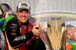 HOMESTEAD, FL - NOVEMBER 20:  Tony Stewart, driver of the #14 Office Depot/Mobil 1 Chevrolet, celebrates with the trophy in Victory Lane after winning the NASCAR Sprint Cup Series Ford 400 and the 2011 Series Championship at Homestead-Miami Speedway on November 20, 2011 in Homestead, Florida. Stewart wins his third NASCAR Championship.  (Photo by Jared C. Tilton/Getty Images)