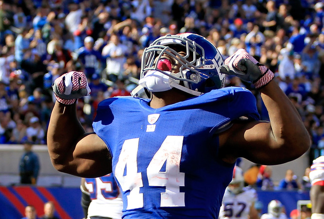 EAST RUTHERFORD, NJ - OCTOBER 16:  Ahmad Bradshaw #44 of the New York Giants celebrates his touchdown against the Buffalo Bills during the first half at MetLife Stadium on October 16, 2011 in East Rutherford, New Jersey.  (Photo by Chris Trotman/Getty Images)