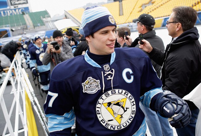 PITTSBURGH, PA - DECEMBER 31:  Sidney Crosby #87 of the Pittsburgh Penguins is greeted by fans while walking out to the rink for practice ahead of the 2011 NHL Winter Classic between the Penguins and the Washington Capitals on December 31, 2010 at Heinz Field in Pittsburgh, Pennsylvania.  (Photo by Jamie Squire/Getty Images)