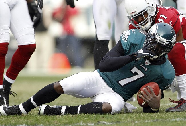 PHILADELPHIA, PA - NOVEMBER 13: Michael Vick #7 of the Philadelphia Eagles is tackled by Richard Marshall #31 of the Arizona Cardinals during a game at Lincoln Financial Field on November 13, 2011 in Philadelphia, Pennsylvania. The Cardinals defeated the Eagles 21-17. (Photo by Rich Schultz /Getty Images)