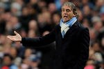 MANCHESTER, ENGLAND - OCTOBER 18:  Manchester City Manager Roberto Mancini reacts during the UEFA Champions League Group A match between Manchester City and Villareal CF at the Etihad Stadium on October 18, 2011 in Manchester, England.  (Photo by Michael Regan/Getty Images)