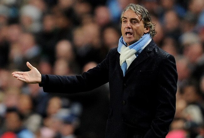 MANCHESTER, ENGLAND - OCTOBER 18:  Manchester City Manager Roberto Mancini reacts during the UEFA Champions League Group A match between Manchester City and Villareal CF at the Etihad Stadium on October 18, 2011 in Manchester, England.  (Photo by Michael Regan/Getty Images)