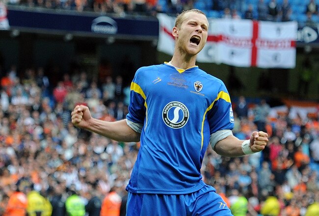 MANCHESTER, ENGLAND - MAY 21:  Seb Hatton of AFC Wimbledon celebrates scoring a penalty in the shoot out during the Blue Square Bet Premier League Play Off Final between AFC Wimbledon and Luton Town at City of Manchester Stadium on May 21, 2011 in Manchester, England.  (Photo by Chris Brunskill/Getty Images)