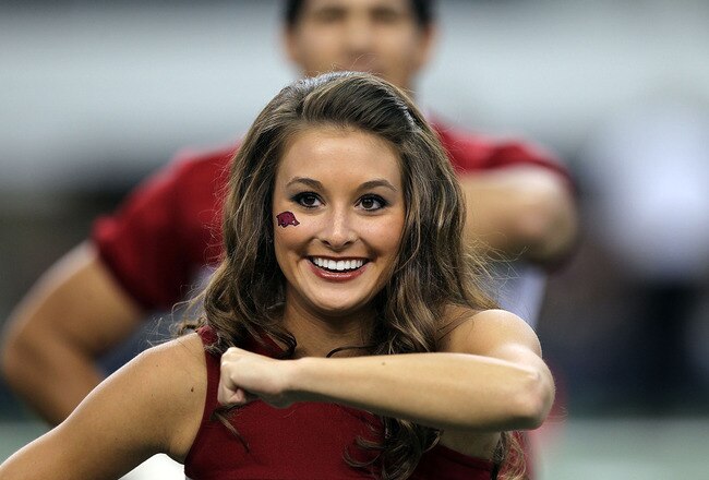 ARLINGTON, TX - OCTOBER 01:  An Arkansas Razorbacks cheerleader during play against the Texas A&M Aggies at Cowboys Stadium on October 1, 2011 in Arlington, Texas.  (Photo by Ronald Martinez/Getty Images)