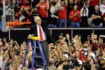 LAS VEGAS, NV - MARCH 12:  Head coach Steve Fisher of the San Diego State Aztecs waves a net after cutting it down following the team's 72-54 victory over the Brigham Young University Cougars in the championship game of the Conoco Mountain West Conference Basketball tournament at the Thomas & Mack Center March 12, 2011 in Las Vegas, Nevada.  (Photo by Ethan Miller/Getty Images)