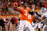 BLACKSBURG, VIRGINIA - NOVEMBER 17:  Quarterback Logan Thomas #3 of the Virginia Tech Hokies throws the ball as defensive tackle Tydreke Powell #91 of the North Carolina Tar Heels chases at Lane Stadium on November 17, 2011 in Blacksburg, Virginia. (Photo by Geoff Burke/Getty Images)