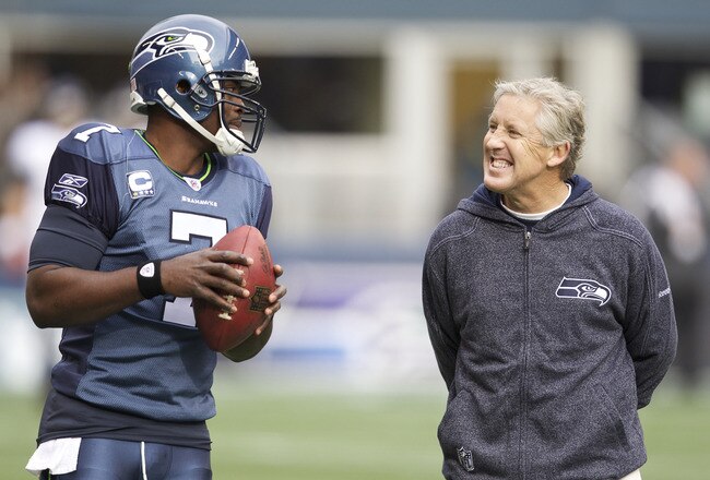 SEATTLE, WA - NOVEMBER 13: Quarterback Tarvaris Jackson #7 of the Seattle Seahawks talks with Seattle Seahawks head coach Pete Carroll while warming up before a game against the Baltimore Ravens at CenturyLink Field on November 13, 2011 in Seattle, Washington. The Seahawks won 22-17.  (Photo by Stephen Brashear /Getty Images)