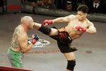 In his MMA debut, Cung Le (right) knocks out Mike Altman with a first-round kick during the 'StrikeForce' professional mixed martial arts event March 10, 2006 at HP Pavilion in San Jose, California USA. (Photo by John Medina/Getty Images)