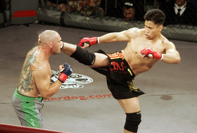 In his MMA debut, Cung Le (right) knocks out Mike Altman with a first-round kick during the 'StrikeForce' professional mixed martial arts event March 10, 2006 at HP Pavilion in San Jose, California USA. (Photo by John Medina/Getty Images)