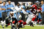 ATLANTA, GA - NOVEMBER 20:  Michael Turner #33 of the Atlanta Falcons rushes away from Michael Griffin #33 of the Tennessee Titans at Georgia Dome on November 20, 2011 in Atlanta, Georgia.  (Photo by Kevin C. Cox/Getty Images)