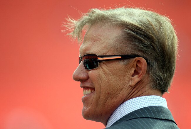 MIAMI GARDENS, FL - OCTOBER 23: General manager John Elway of the Denver Broncos watches his team prior to taking on the Miami Dolphins at Sun Life Stadium on October 23, 2011 in Miami Gardens, Florida.  (Photo by Marc Serota/Getty Images)