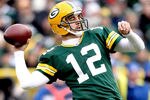GREEN BAY, WI - NOVEMBER 20:  Aaron Rodgers #12 of the Green Bay Packers throws against the Tampa Bay Buccaneers at Lambeau Field on November 20, 2011 in Green Bay, Wisconsin.  (Photo by Matthew Stockman/Getty Images)