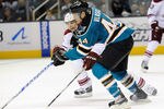 SAN JOSE, CA - SEPTEMBER 24: Marc-Edouard Vlasic #44 of the San Jose Sharks fights to control the puck away from Radim Vrbata #17 of the Phoenix Coyotes in the second period during an NHL pre-season hockey game at HP Pavilion on September 24, 2011 in San Jose, California.  (Photo by Thearon W. Henderson/Getty Images)