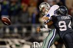SEATTLE - JANUARY 06:  Quarterback Tony Romo #9 of the Dallas Cowboys is taken down by Bryce Fisher #94 of the Seattle Seahawks near the Cowboys goal line in the second half of the NFC Wild Card Playoff Game on January 6, 2007 at Qwest Field in Seattle, Washington.  (Photo by Otto Greule Jr/Getty Images)