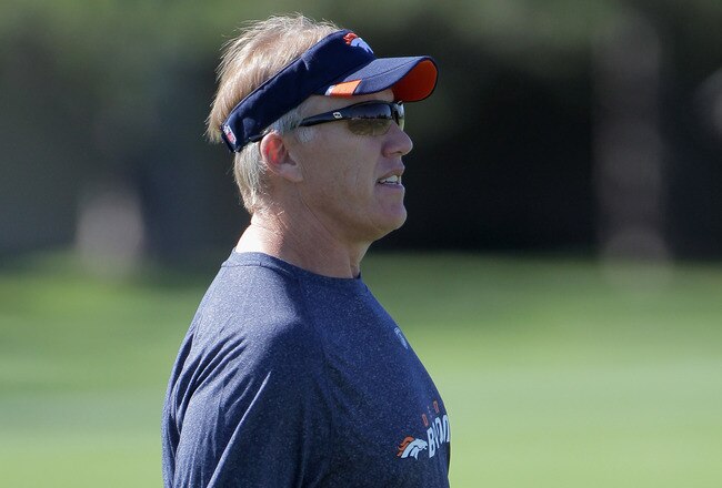 ENGLEWOOD, CO - JULY 28:  John Elway, Executive Vice President of Football Operations for the Denver Broncos watches practice from the sideline during training camp at the Paul D. Bowlen Memorial Broncos Centre at Dove Valley on July 28, 2011 in Englewood, Colorado.  (Photo by Doug Pensinger/Getty Images)