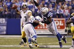 INDIANAPOLIS, IN - SEPTEMBER 25: Ben Roethlisberger #7 of the Pittsburgh Steelers looks to pass while under pressure from Dwight Freeney #93 and Robert Mathis #98 of the Indianapolis Colts at Lucas Oil Stadium on September 25, 2011 in Indianapolis, Indiana. The Steelers won 23-20. (Photo by Joe Robbins/Getty Images)