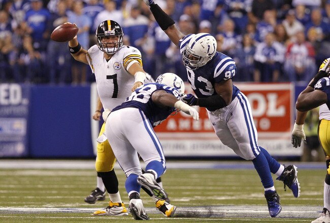 INDIANAPOLIS, IN - SEPTEMBER 25: Ben Roethlisberger #7 of the Pittsburgh Steelers looks to pass while under pressure from Dwight Freeney #93 and Robert Mathis #98 of the Indianapolis Colts at Lucas Oil Stadium on September 25, 2011 in Indianapolis, Indiana. The Steelers won 23-20. (Photo by Joe Robbins/Getty Images)