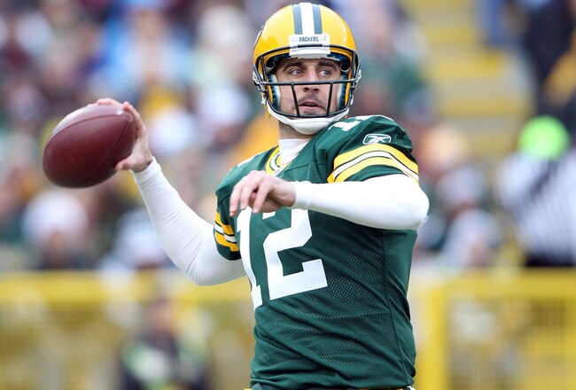 GREEN BAY, WI - NOVEMBER 20:  Aaron Rodgers #12 of the Green Bay Packers looks to pass in the first quarter against the Tampa Bay Buccaneers on November 20,2011 at Lambeau Field in Green Bay, Wisconsin.  (Photo by Elsa/Getty Images)