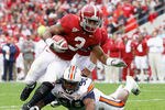TUSCALOOSA, AL - NOVEMBER 26:  Trent Richardson #3 of the Alabama Crimson Tide is tackled by Nick Fairly #90 of the Auburn Tigers at Bryant-Denny Stadium on November 26, 2010 in Tuscaloosa, Alabama.  (Photo by Kevin C. Cox/Getty Images)