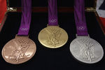 PONTYCLUN, WALES - OCTOBER 27:  Production begins on the London 2012 victory medals at the Royal Mint on October 27, 2011 in Pontyclun, Wales. A total of 4700 medals will be made, split between the Olympics and Paralympics. Each medal, 85mm in diameter are the heaviest summer Olympic medals made and production will be completed by Spring 2012  (Photo by Michael Steele/Getty Images)