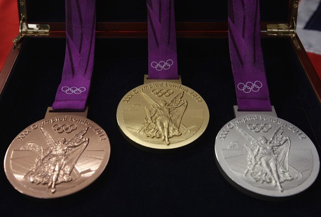 PONTYCLUN, WALES - OCTOBER 27:  Production begins on the London 2012 victory medals at the Royal Mint on October 27, 2011 in Pontyclun, Wales. A total of 4700 medals will be made, split between the Olympics and Paralympics. Each medal, 85mm in diameter are the heaviest summer Olympic medals made and production will be completed by Spring 2012  (Photo by Michael Steele/Getty Images)