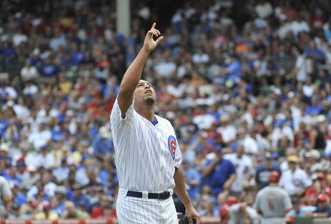 CHICAGO, IL - AUGUST 06:  Starting pitcher Carlos Zambrano #38 of the Chicago Cubs points to the sky after finishing the sixth inning against the Cincinnati Reds at Wrigley Field on August 6, 2011 in Chicago, Illinois.  (Photo by Brian Kersey/Getty Images)