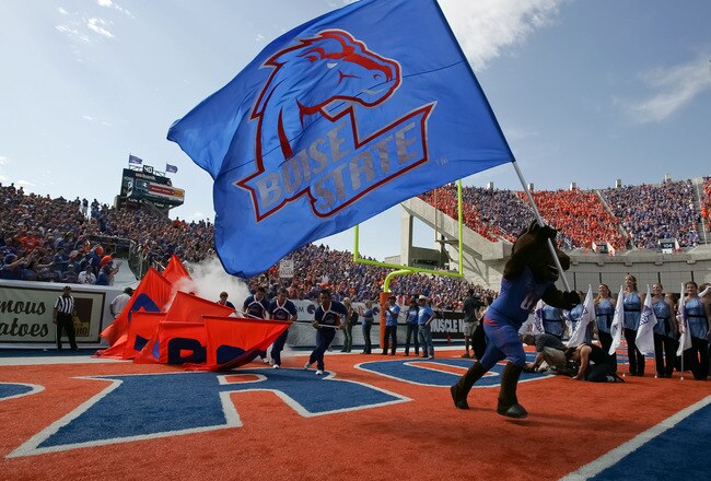 BOISE, ID - OCTOBER 01:  Boise State Broncos mascot Buster Bronco runs a flag onto the field before the game against the Nevada Wolf Pack at Bronco Stadium on October 1, 2011 in Boise, Idaho.  (Photo by Otto Kitsinger III/Getty Images)