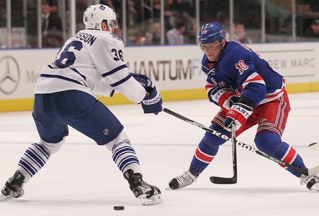 NEW YORK, NY - OCTOBER 27: Marian Gaborik #10 of the New York Rangers skates against Carl Gunnarsson #36 of the Toronto Maple Leaves at Madison Square Garden on October 27, 2011 in New York City.  (Photo by Nick Laham/Getty Images)
