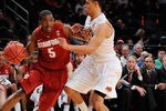 NEW YORK, NY - NOVEMBER 23:  Chasson Randle #5 of the Stanford Cardinal drives the ball against Cezar Guerrero #1 of the Oklahoma State Cowboys during the 2011 Dick's Sporting Goods NIT Season Tip-Off at Madison Square Garden on November 23, 2011 in New York City.  (Photo by Patrick McDermott/Getty Images)