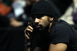 LONDON, ENGLAND - NOVEMBER 21:  Boxer David Haye is on the phone during the men's doubles first round match between Robert Lindstedt of Sweden and Horia Tecau of Romania against Mahesh Bhupathi of India and Leander Paes of India  during the Barclays ATP World Tour Finals at the O2 Arena on November 21, 2011 in London, England.  (Photo by Clive Brunskill/Getty Images)