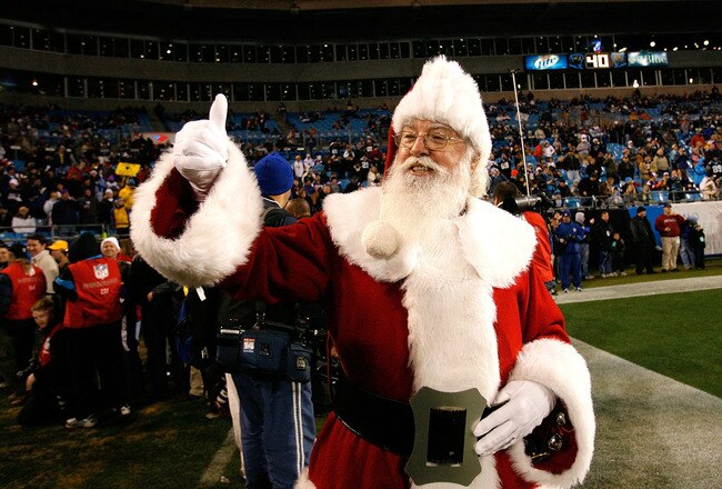 CHARLOTTE, NC - DECEMBER 20:  Santa Claus walks onto the field before the game against the Minnesota Vikings and the Carolina Panthers at Bank of America Stadium on December 20, 2009 in Charlotte, North Carolina.  (Photo by Kevin C. Cox/Getty Images)