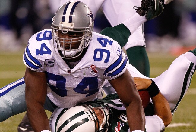 EAST RUTHERFORD, NJ - SEPTEMBER 11:  DeMarcus Ware #94 of the Dallas Cowboys sacks Mark Sanchez #6 of the New York Jets in the first half during their NFL Season Opening Game at MetLife Stadium on September 11, 2011 in East Rutherford, New Jersey.  (Photo by Jeff Zelevansky/Getty Images)