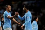 MANCHESTER, ENGLAND - MAY 10:  Joe Hart (L), Vincent Kompany and Joleon Lescott (R) of Manchester City celebrate at the end of the Barclays Premier League match between Manchester City and Tottenham Hotspur at the City of Manchester Stadium on May 10, 2011 in Manchester, England.  (Photo by Michael Regan/Getty Images)
