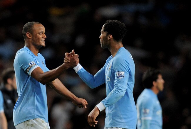 MANCHESTER, ENGLAND - MAY 10:  Joe Hart (L), Vincent Kompany and Joleon Lescott (R) of Manchester City celebrate at the end of the Barclays Premier League match between Manchester City and Tottenham Hotspur at the City of Manchester Stadium on May 10, 2011 in Manchester, England.  (Photo by Michael Regan/Getty Images)
