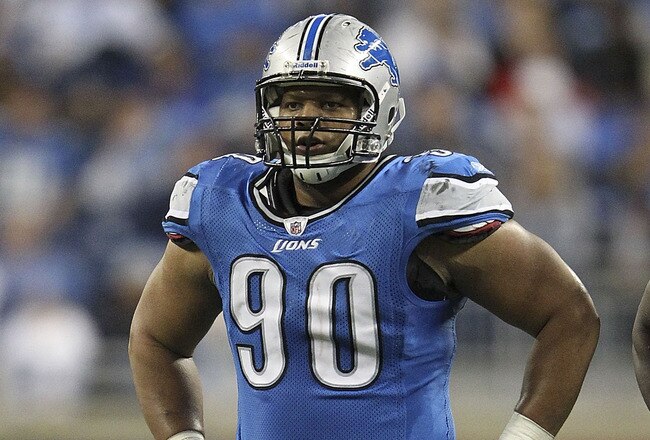 DETROIT - NOVEMBER 20: Ndamukong Suh #90 of the Detroit Lions checks the defense during the game against the Carolina Panthers at Ford Field on November 20, 2011 in Detroit, Michigan. The Lions defeated the Panthers 49-35.  (Photo by Leon Halip/Getty Images)