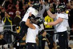 STANFORD, CA - NOVEMBER 12: De'Anthony Thomas #6, Hroniss Grasu #55 and Everett Benyard #71 of the Oregon Ducks celebrates after Thomas went forty one yards on a pass play for a touchdown against the Stanford Cardinal at Stanford Stadium on November 12, 2011 in Stanford, California.  (Photo by Thearon W. Henderson/Getty Images)
