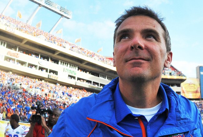 TAMPA, FL - JANUARY 1:  Coach Urban Meyer of the Florida Gators leaves the field after play against the Penn State Nittany Lions January 1, 2010 in the 25th Outback Bowl at Raymond James Stadium in Tampa, Florida.  (Photo by Al Messerschmidt/Getty Images)