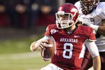 LITTLE ROCK, AR - NOVEMBER 19:   Quarterback Tyler Wilson #8 of the Arkansas Razorbacks slides to ground after running the ball against the Mississippi State Bulldogs at War Memorial Stadium on November 19, 2011 in Little Rock, Arkansas. The Razorbacks defeated the Bulldogs 44-17.  (Photo by Wesley Hitt/Getty Images)