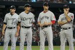 PHOENIX, AZ - JULY 12:  American League All-Star Carlos Quentin #20 of the Chicago White Sox stands with American League All-Star Paul Konerko #14 of the Chicago White Sox, American League All-Star Jon Lester #31 of the Boston Red Sox, and American League All-Star Kevin Youkilis #20 of the Boston Red Sox before the start of the 82nd MLB All-Star Game at Chase Field on July 12, 2011 in Phoenix, Arizona.  (Photo by Jeff Gross/Getty Images)