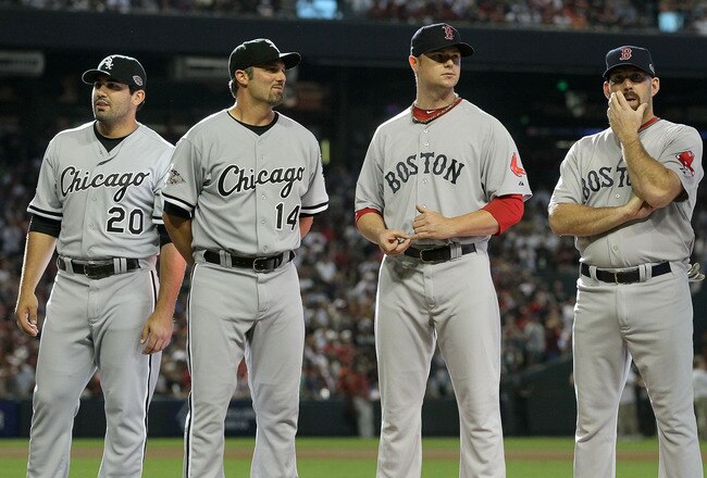 PHOENIX, AZ - JULY 12:  American League All-Star Carlos Quentin #20 of the Chicago White Sox stands with American League All-Star Paul Konerko #14 of the Chicago White Sox, American League All-Star Jon Lester #31 of the Boston Red Sox, and American League All-Star Kevin Youkilis #20 of the Boston Red Sox before the start of the 82nd MLB All-Star Game at Chase Field on July 12, 2011 in Phoenix, Arizona.  (Photo by Jeff Gross/Getty Images)