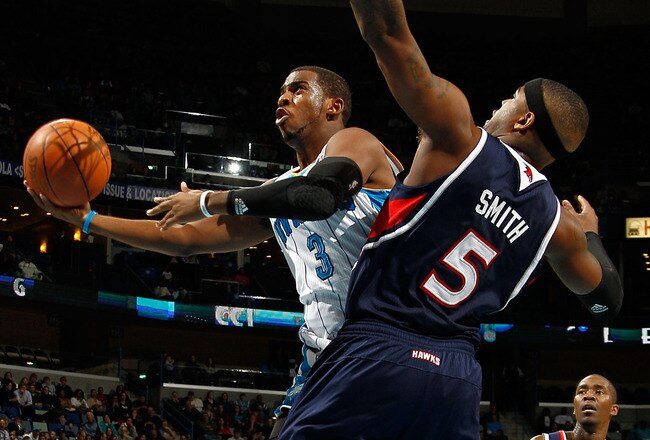 NEW ORLEANS, LA - DECEMBER 26:  Chris Paul #3 of the New Orleans Hornets shoots the ball over Josh Smith #5 of the Atlanta Hawks at the New Orleans Arena on December 26, 2010 in New Orleans, Louisiana.  NOTE TO USER: User expressly acknowledges and agrees that, by downloading and or using this photograph, User is consenting to the terms and conditions of the Getty Images License Agreement.  (Photo by Chris Graythen/Getty Images)