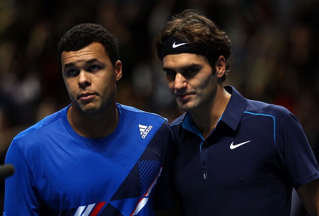 LONDON, ENGLAND - NOVEMBER 20:  Jo-Wilfried Tsonga of France reacts next to Roger Federer of Switzerland after the men's singles first round match at the Barclays ATP World Tour Finals at the O2 Arena on November 20, 2011 in London, England.  (Photo by Clive Brunskill/Getty Images)