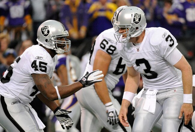 MINNEAPOLIS, MN - NOVEMBER 20: Carson Palmer #3 of the Oakland Raiders calls a play on the line of scrimmage to Marcel Reece #45 in the fourth quarter against the Minnesota Vikings on November 20, 2011 at Hubert H. Humphrey Metrodome in Minneapolis, Minnesota. The Raiders defeated the Vikings 27-21. (Photo by Hannah Foslien/Getty Images)
