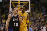 LOS ANGELES - MAY 31:  Kobe Bryant #8 of the Los Angeles Lakers talks to Mike Bibby #10 of the Sacramento Kings in Game six of the Western Conference Finals during the 2002 NBA Playoffs on May 31, 2002 at Staples Center in Los Angeles, California.  The Lakers won 106-102.  NOTE TO USER: User expressly acknowledges and agrees that, by downloading and/or using this Photograph, User is consenting to the terms and conditions of the Getty Images License Agreement. (Photo by Jed Jacobsohn/Getty Images)