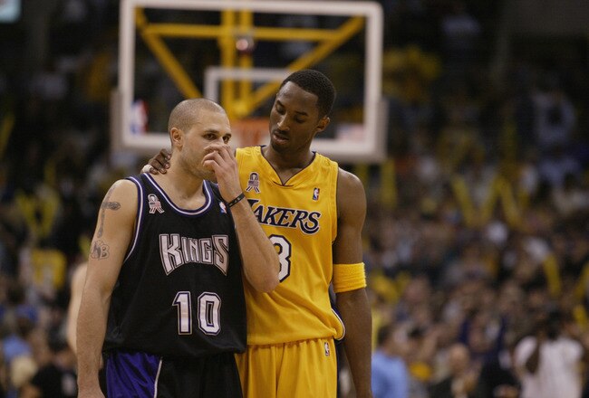 LOS ANGELES - MAY 31:  Kobe Bryant #8 of the Los Angeles Lakers talks to Mike Bibby #10 of the Sacramento Kings in Game six of the Western Conference Finals during the 2002 NBA Playoffs on May 31, 2002 at Staples Center in Los Angeles, California.  The Lakers won 106-102.  NOTE TO USER: User expressly acknowledges and agrees that, by downloading and/or using this Photograph, User is consenting to the terms and conditions of the Getty Images License Agreement. (Photo by Jed Jacobsohn/Getty Images)