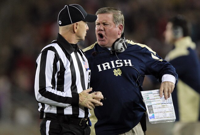 STANFORD, CA - NOVEMBER 26: Notre Dame Fighting Irish head coach Brian Kelly argues a call with side judge Glenn Crowther during their game against the Stanford Cardinal at Stanford Stadium on November 26, 2011 in Stanford, California.  (Photo by Ezra Shaw/Getty Images)
